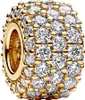 A close-up studio shot of a gold charm encrusted with clear cubic zirconia stones. Podgląd zdjęcia produktu