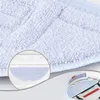 A close-up view of a white microfiber mop pad, with a circular inset showing a detail of the mop pad and a robotic vacuum cleaner. Produktbild-Vorschau