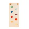 A wooden climbing board with colorful grips against a white background. Produktbild-Vorschau