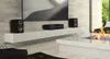 A modern living room with a fireplace, television, and audio equipment. Podgląd zdjęcia produktu