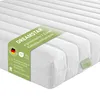 A white mattress with a green label indicating product features and brand. Anteprima dell’immagine prodotto