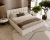 A bedroom scene with a white upholstered bed, side table, and a plant. Produktbild-Vorschau