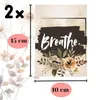 A graphic showing a framed picture with the word 'Breathe' and floral elements, along with size indicators. Produktbild-Vorschau