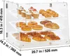A three-tier clear acrylic display case filled with various baked goods, including cupcakes, donuts, croissants, and other pastries. Náhled obrázku produktu