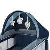 Close-up view of the top canopy and hanging toys of a baby crib. Produktbild-Vorschau