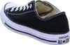 A black Converse All Star shoe is shown from the side. Voir les images du produit