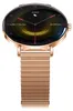 A close-up studio shot of a rose gold smartwatch with a mesh band, displaying its digital face. Podgląd zdjęcia produktu