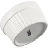 A white ceramic ramekin is shown from a low angle, tilted to the side. Produktbild-Vorschau