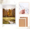 A framed picture of a forest scene with a small cabin, and close-ups of frame components. Produktbild-Vorschau