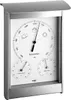 A weather station with a barometer, thermometer, and hygrometer, mounted in a silver frame. Anteprima dell’immagine prodotto