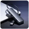 A gray USB hub splitter is placed on a laptop. Produktbild-Vorschau