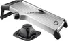 A stainless steel mandoline slicer with a black plastic handle and a black plastic food holder, shown against a white background. Produktbild-Vorschau