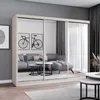A modern living room with a large mirrored wardrobe reflecting a sofa and coffee table. Voir les images du produit