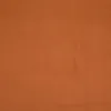 A close-up, full-frame shot of a terracotta-colored fabric. Produktbild-Vorschau