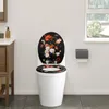 A toilet with a decorative lid in a bathroom. Produktbild-Vorschau