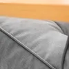 A close-up view of a gray cushion with a wooden frame in the background. Podgląd zdjęcia produktu