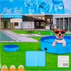 A dog in sunglasses sits in a blue pet pool on a green lawn, with a house and yard in the background. Anteprima dell’immagine prodotto