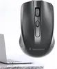 A black wireless optical mouse is shown floating above a desk next to a laptop. Náhľad obrázku produktu