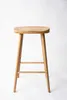 A wooden bar stool on a white background. Produktbild-Vorschau
