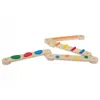 A set of wooden balance beams with colorful shapes on them, arranged diagonally on a white background. Produktbild-Vorschau