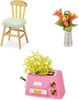 A collage of three miniature items: a wooden chair with a green cushion, a vase with orange flowers, and a pink toaster with a yellow plant. Náhled obrázku produktu
