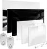 A collection of flat panel heaters in black and white, along with two digital plug-in thermostats. Produktbild-Vorschau