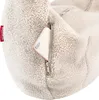 A close-up of a cream-colored, fuzzy bag with a smartphone partially inserted into a zippered pocket. Náhled obrázku produktu