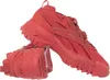 A pair of red Reebok Cardi B Club C V2 sneakers. Voir les images du produit