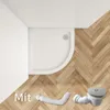 A white corner shower tray with a drain and flexible pipe on a wooden floor. Produktbild-Vorschau