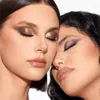 Two women with their eyes closed, leaning their faces together, showcasing makeup. Produktbild-Vorschau