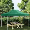 A green party tent set up in a garden with a wooden picnic table and benches underneath. Podgląd zdjęcia produktu