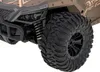 Close-up of the front wheel and suspension of a brown RC car. Anteprima dell’immagine prodotto