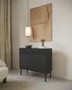 A modern living room with a dark wood sideboard, artwork, and a pendant light. Produktbild-Vorschau