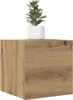 A wooden cube shelf with a small potted plant on top. Produktbild-Vorschau