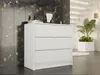 A white dresser with three drawers is shown in a room with a dark, textured wall and a white staircase in the background. Anteprima dell’immagine prodotto