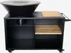 A black outdoor grill cart with a fire bowl and a cutting board on top, shown against a white background. Produktbild-Vorschau