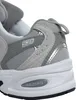 A close-up view of the heel and sole of a gray New Balance sneaker. Produktbild-Vorschau