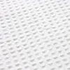 A close-up, textured view of white waffle fabric. Náhled obrázku produktu