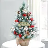 A small, decorated artificial Christmas tree on a table. Produktbild-Vorschau