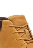 A close-up view of the lacing and suede material of a tan chukka boot. Produktbild-Vorschau