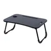 A black folding lap desk with legs, shown from a slightly elevated diagonal angle against a white background. Anteprima dell’immagine prodotto