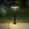 A solar-powered garden light illuminates a lawn and pathway at night. Produktbild-Vorschau