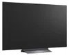 A black LG OLED TV is shown from a side angle, resting on its stand. Podgląd zdjęcia produktu