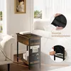A side table with charging ports and storage is shown next to a sofa in a living room. Produktbild-Vorschau