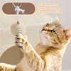 A cat playing with a toy ball hanging from a cat tree. Produktbild-Vorschau