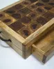 A close-up view of a wooden cutting board with a drawer partially pulled out. Náhľad obrázku produktu