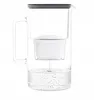 A glass water filter pitcher with a white filter inside, filled with water. Produktbild-Vorschau