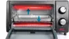 Close-up view of the inside of a toaster oven with the door open, showing two heating elements glowing red and a baking tray. Voir les images du produit