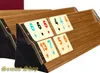 A close-up shot of Rummy tiles arranged on wooden racks. Anteprima dell’immagine prodotto