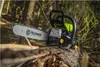 A chainsaw rests on a log in a forest setting. Náhľad obrázku produktu